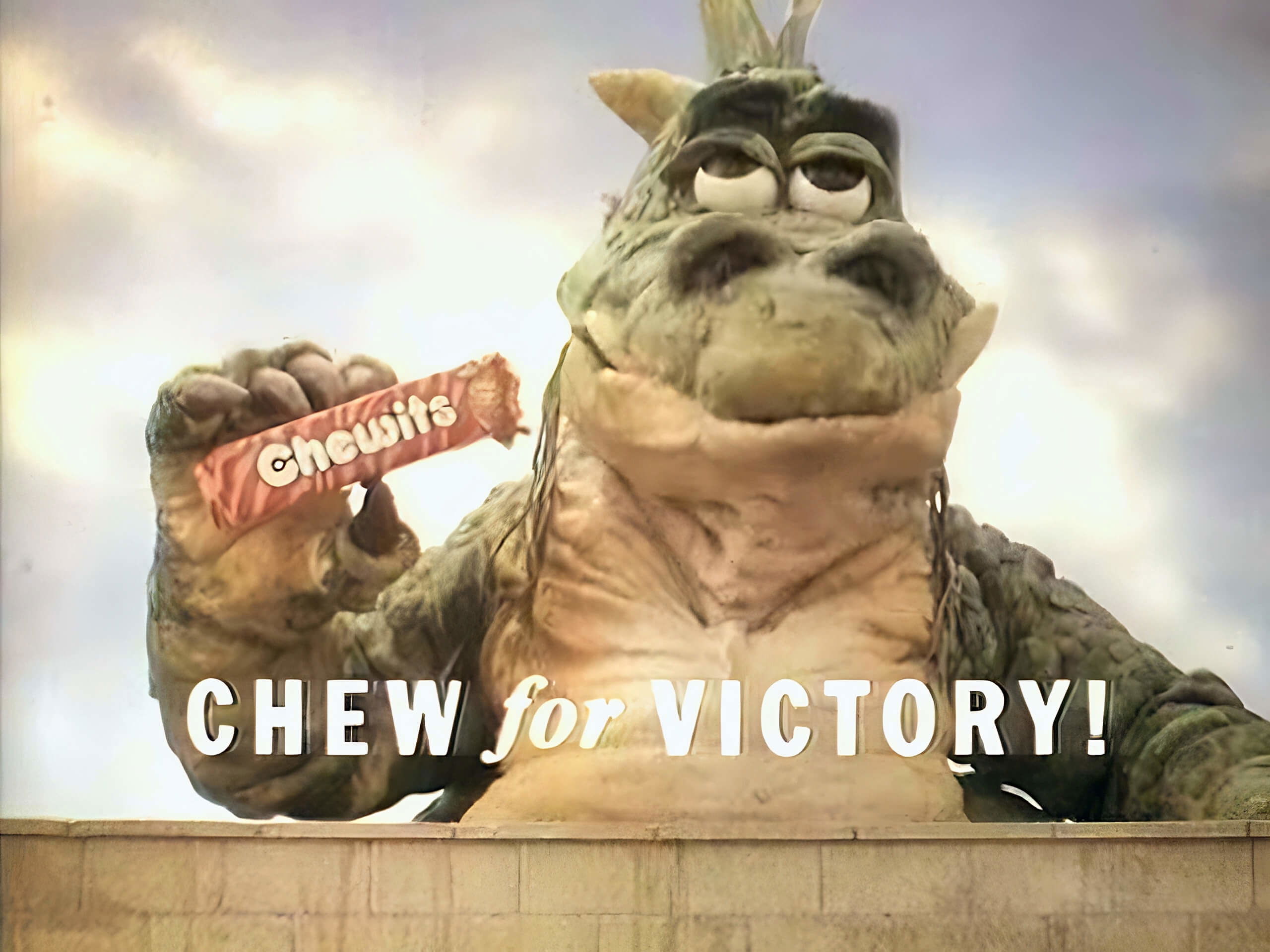 Chewie holding a packet of Strawberry Chewits with strapline Chew for Victory!