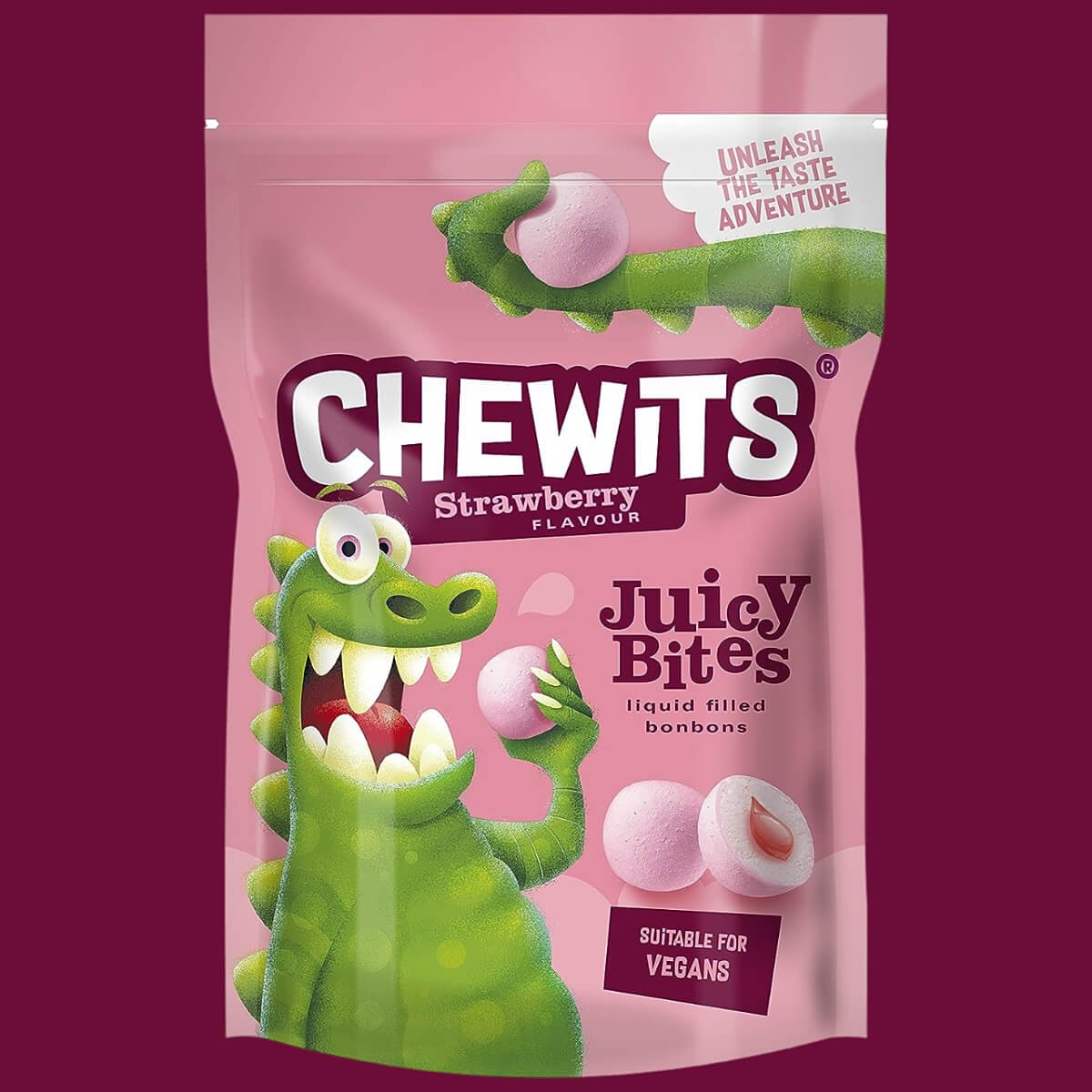A pouch of Chewits Juicy Bites, Strawberry Flavour. Pink and claret packaging with a green dinosaur and claret red background