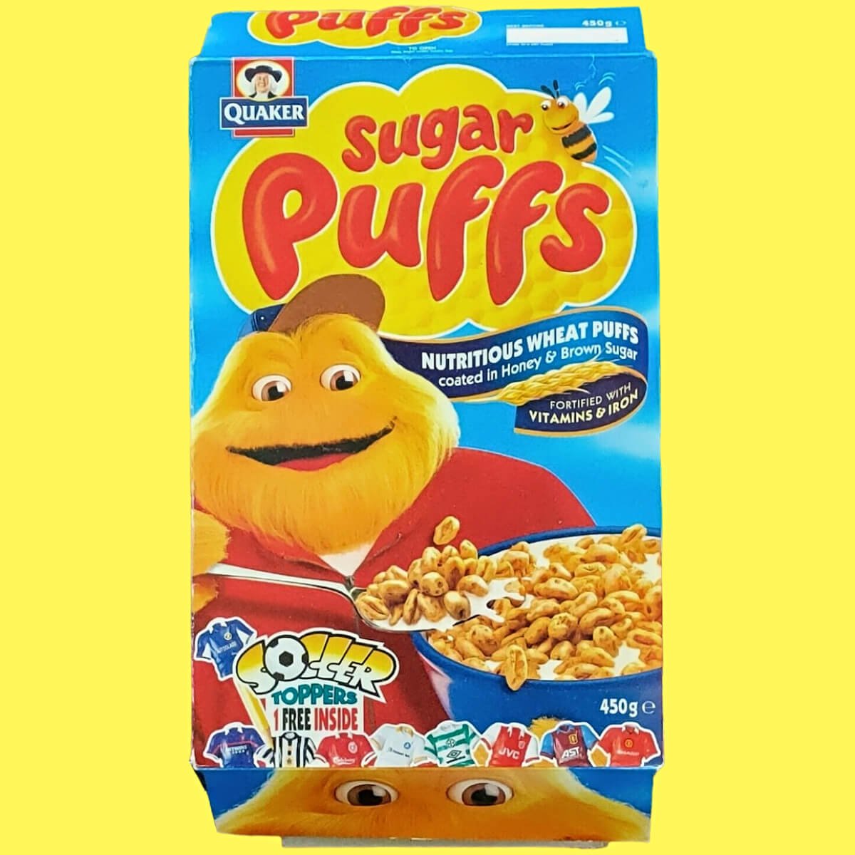 A Sugar Puffs cereal box from the 1990s featuring the Honey Monster.