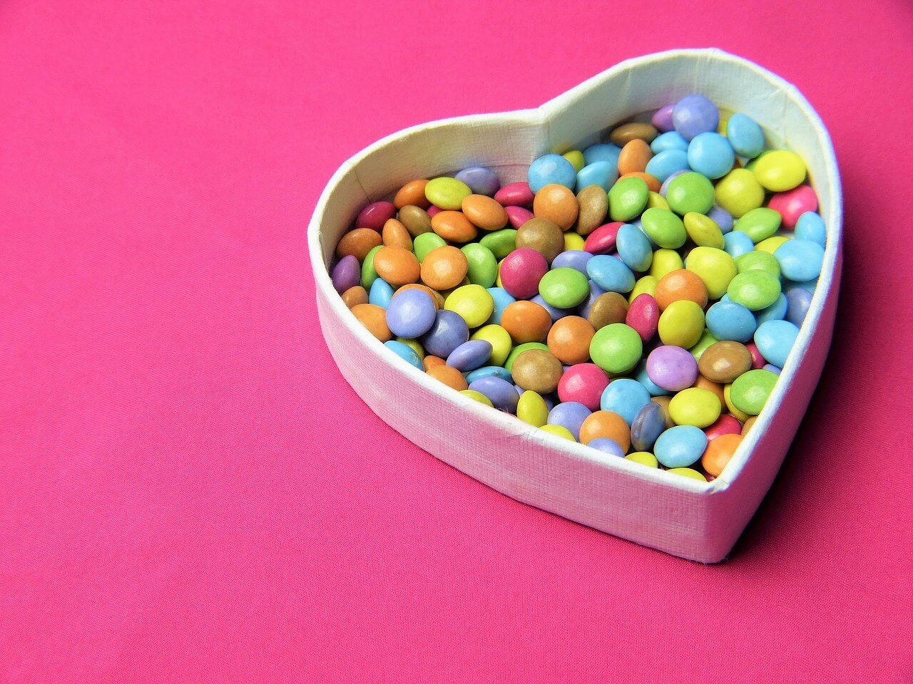 Smarties in a heart-shaped dish