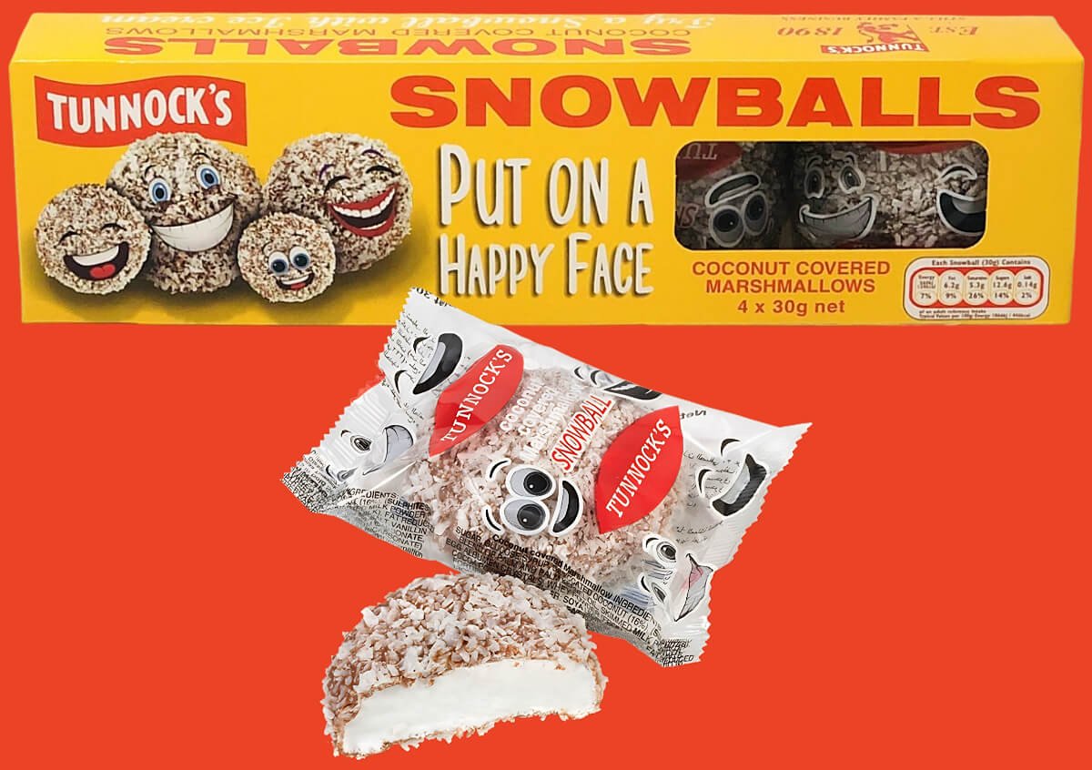 Tunnock's Snowballs in box, and one outside of the box in wrapper, and one sliced in half