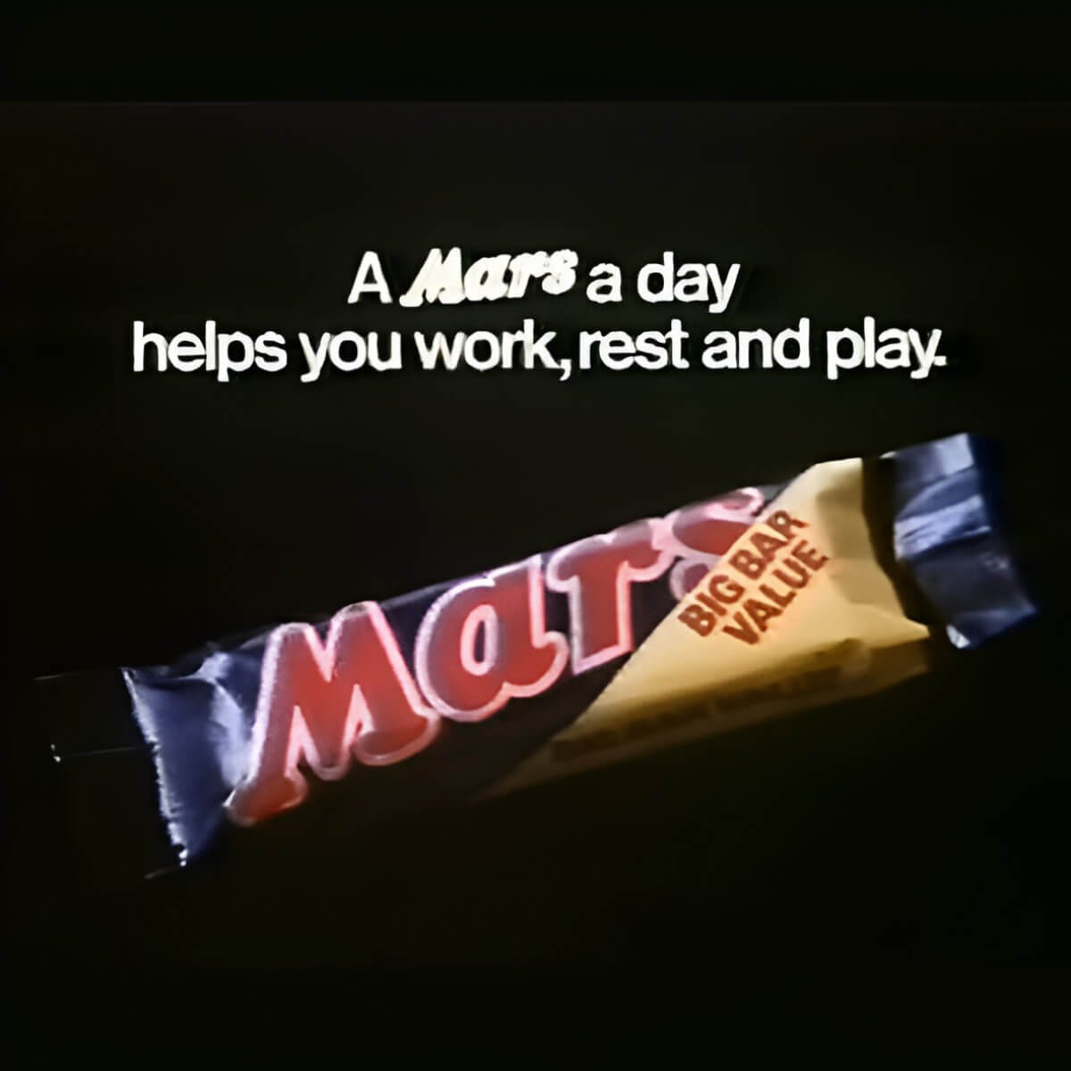 Mars bar with slogan A Mars a day helps you work, rest and play. Black background